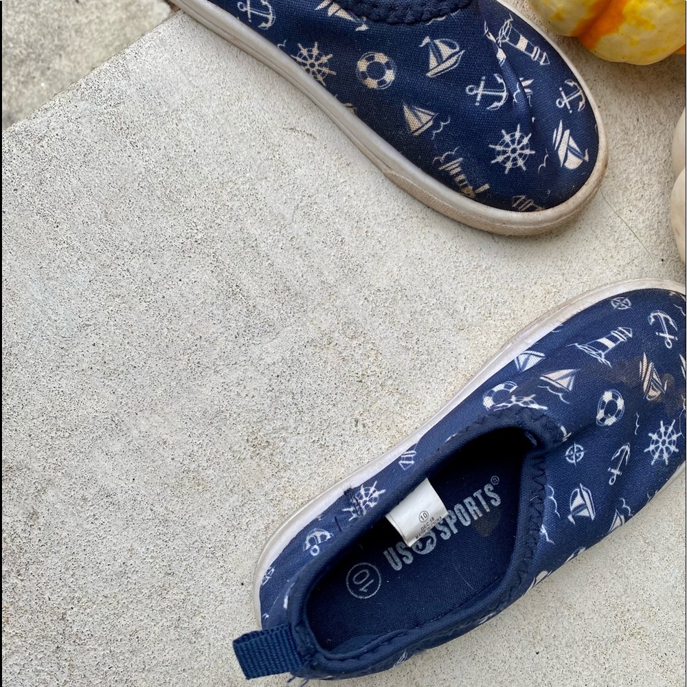 US Sports Navy w white sailboats, lighthouses, anchors; unisex, canvas slip-ons.